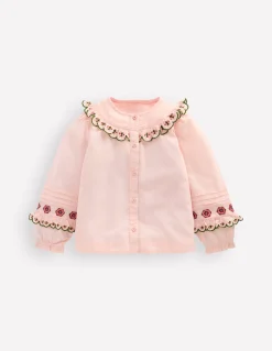 Blouse à empiècement volanté