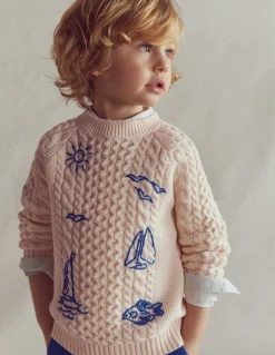 Pull brodé et torsadé