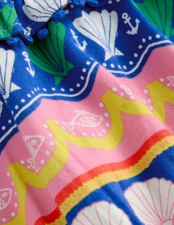 Robe dos-nu à col volanté