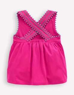 Top à dos croisé détail pompons