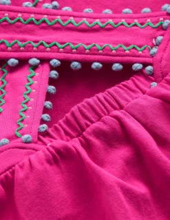 Top à dos croisé détail pompons